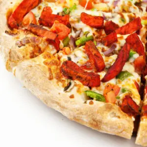 A closeup look at a pizza with a white background