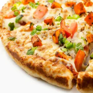 Close-up of a cheesy pizza with toppings.